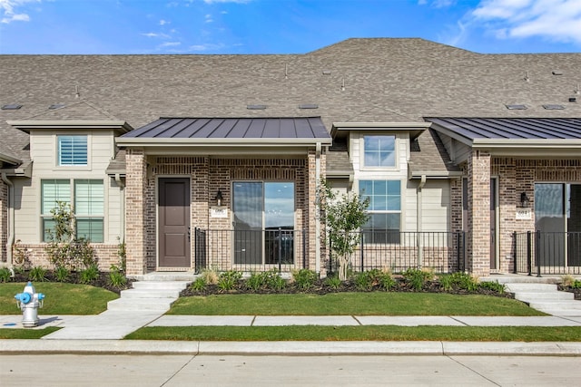 606 Tall Grass Trl, Wylie, TX 75098 - doorway to property with brick siding and a standing seam roof