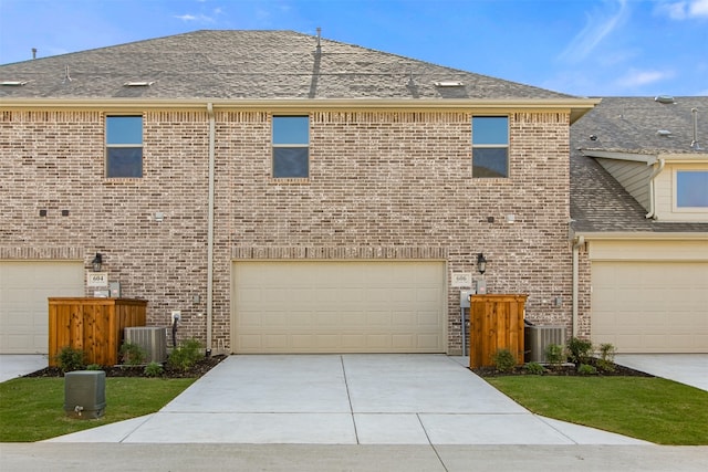606 Tall Grass Trl, Wylie, TX 75098 - view of front of house featuring central AC, brick siding, and fence