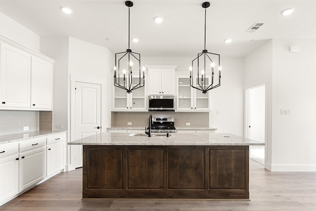 606 Tall Grass Trl, Wylie, TX 75098 - kitchen with appliances with stainless steel finishes, a chandelier, tasteful backsplash, a sink, and recessed lighting