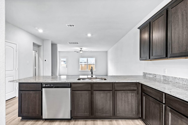 kitchen with sink, dishwasher, ceiling fan, dark brown cabinetry, and kitchen peninsula