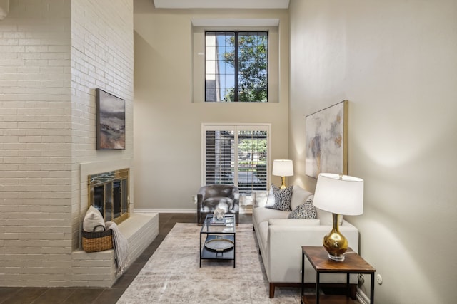 living room with a brick fireplace