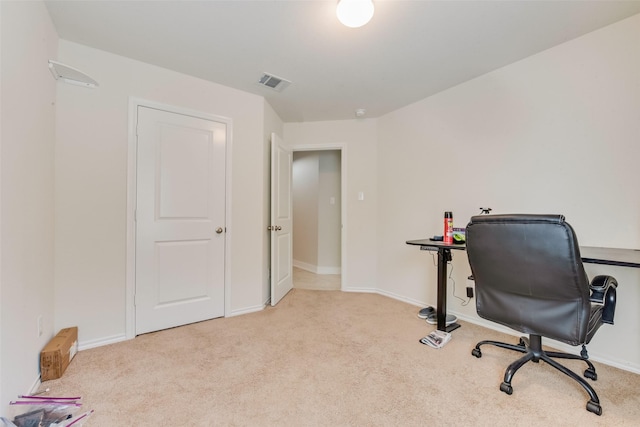 office area featuring light carpet