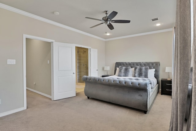 carpeted bedroom with ensuite bath, ornamental molding, and ceiling fan