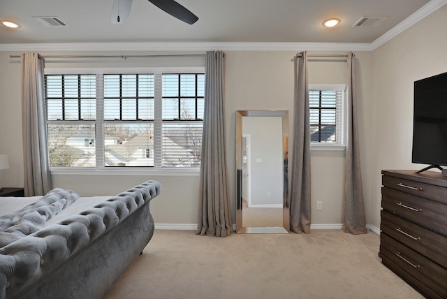 bedroom featuring ceiling fan, ornamental molding, and light colored carpet