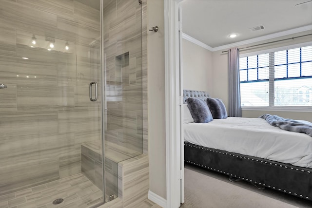 bathroom with a shower with shower door and ornamental molding