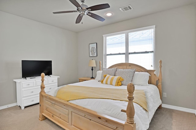 bedroom featuring ceiling fan and light carpet