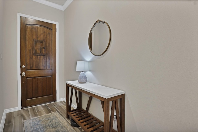 foyer featuring ornamental molding