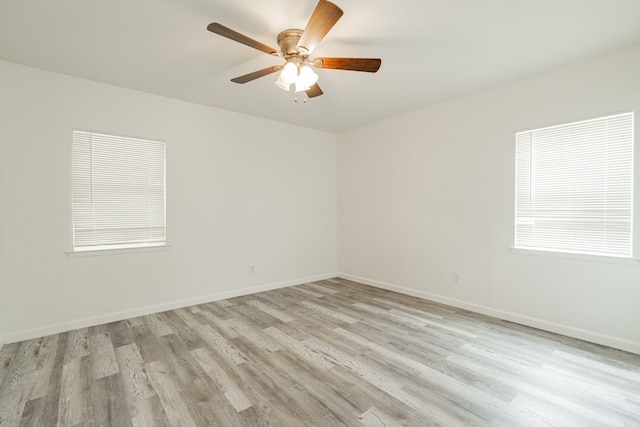 unfurnished room with ceiling fan and light hardwood / wood-style floors