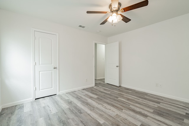 unfurnished room featuring ceiling fan and light hardwood / wood-style flooring