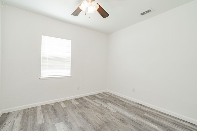 unfurnished room with ceiling fan and light wood-type flooring