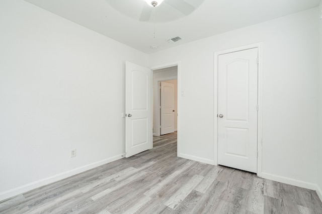 unfurnished bedroom featuring light hardwood / wood-style floors and ceiling fan