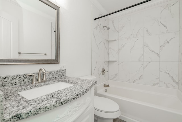 full bathroom with vanity, ornamental molding, toilet, and tiled shower / bath