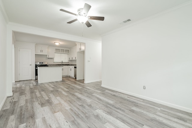 unfurnished living room featuring crown molding, ceiling fan, sink, and light wood-type flooring