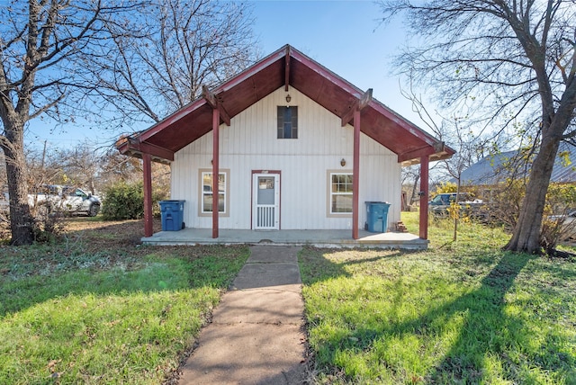 view of outbuilding featuring a yard