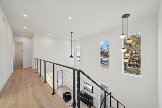 corridor with light hardwood / wood-style flooring