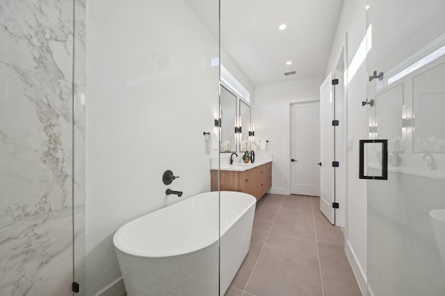 bathroom with tile patterned floors, shower with separate bathtub, and vanity