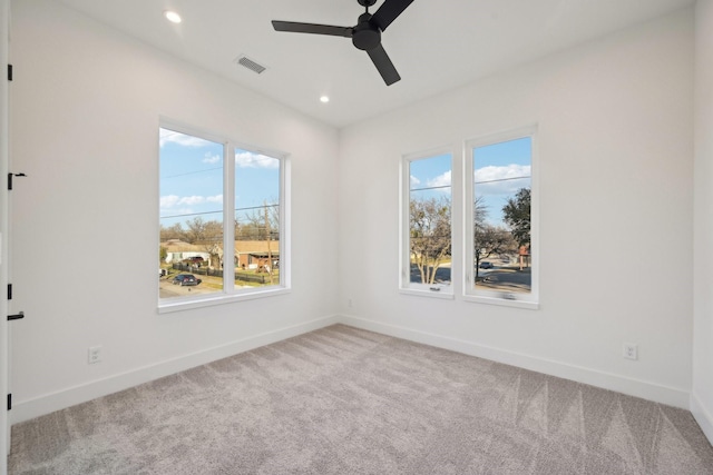 spare room with ceiling fan and carpet flooring