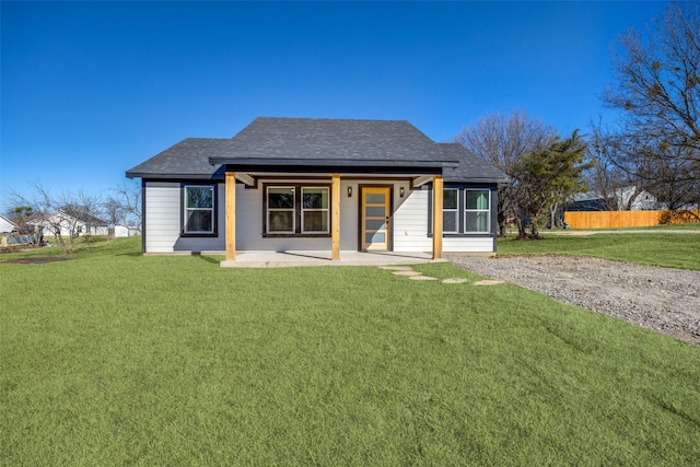 view of front of home featuring a patio and a front lawn