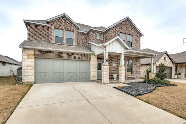 view of front of home with a porch, a garage, and a front lawn