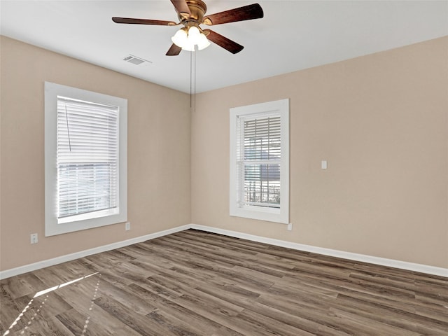 empty room with wood-type flooring and ceiling fan