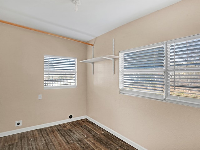 clothes washing area with electric dryer hookup and dark hardwood / wood-style floors