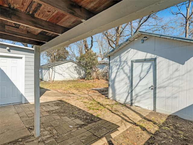 view of patio featuring a storage unit