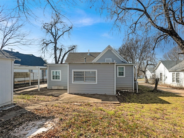 back of property with a patio and a lawn