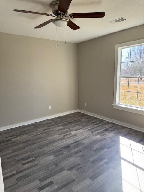 spare room featuring dark hardwood / wood-style floors