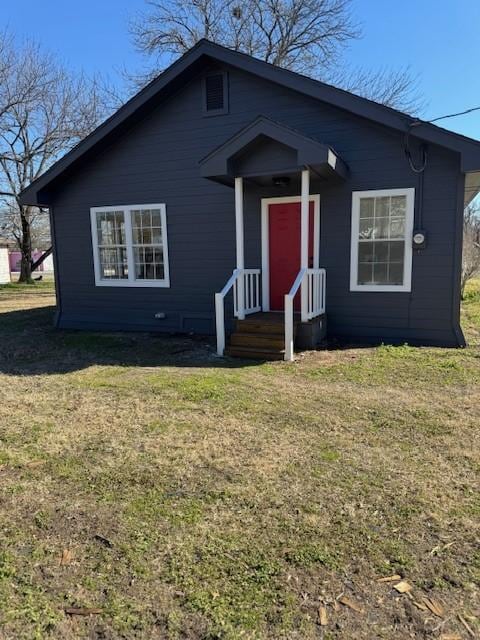 view of front of property with a front lawn