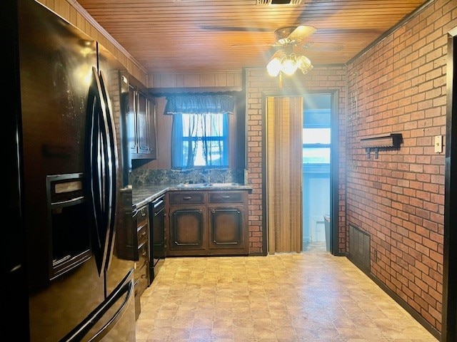 kitchen with brick wall, wooden ceiling, dark brown cabinetry, and black appliances