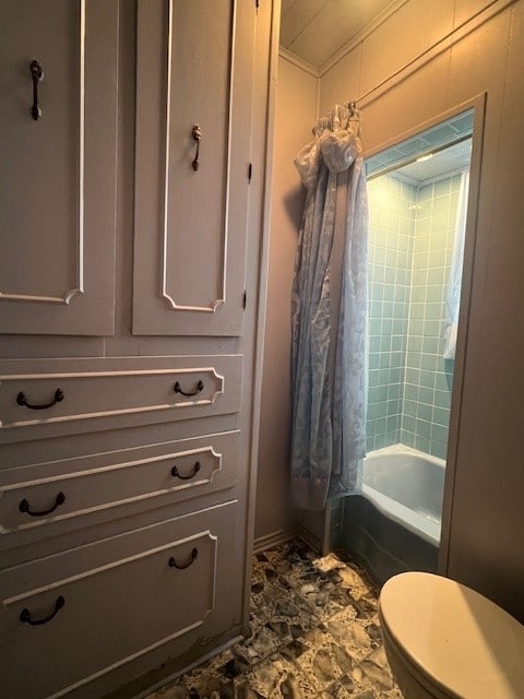 bathroom featuring shower / washtub combination and toilet