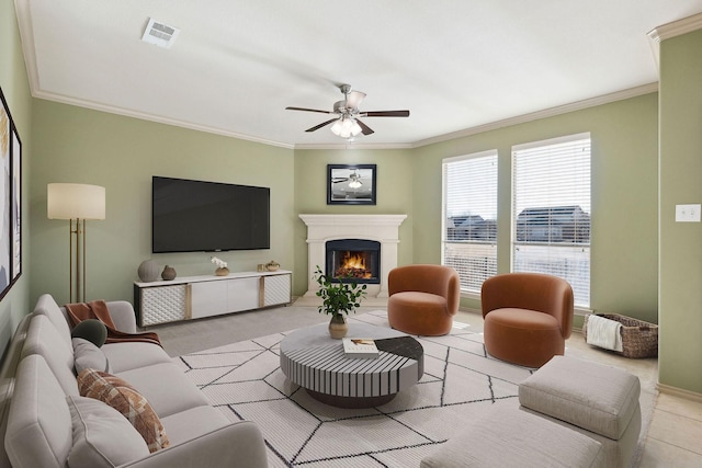 living room featuring crown molding and ceiling fan