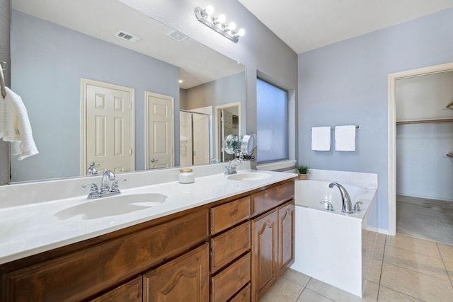 bathroom featuring vanity, tile patterned floors, and shower with separate bathtub