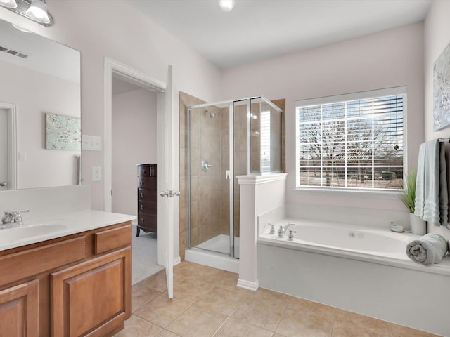 bathroom with vanity, tile patterned floors, and independent shower and bath