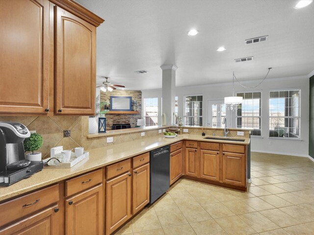 kitchen with decorative light fixtures, ornamental molding, sink, and black appliances