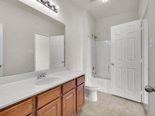 full bathroom featuring tile patterned floors, toilet, bathing tub / shower combination, and vanity