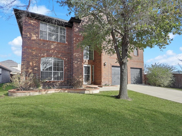 view of front facade with a garage and a front yard