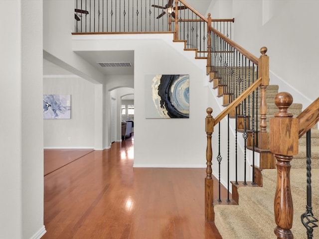 stairs with hardwood / wood-style flooring