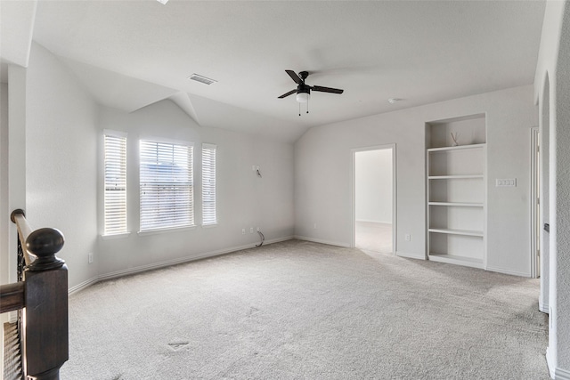 unfurnished bedroom featuring lofted ceiling, light carpet, and ceiling fan