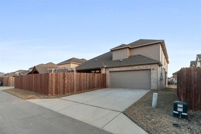 view of side of home featuring a garage