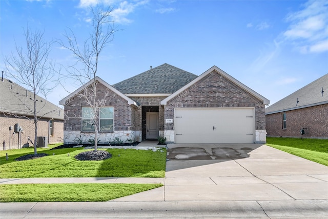 view of front of house featuring a garage, a front yard, and central air condition unit