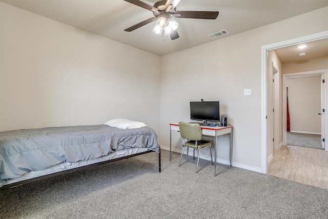 carpeted bedroom featuring ceiling fan