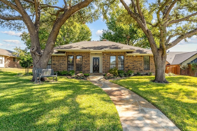 ranch-style home with a front lawn