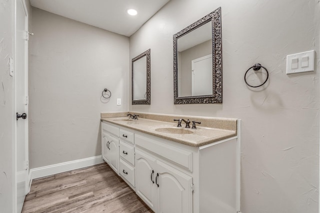 bathroom featuring vanity and hardwood / wood-style floors