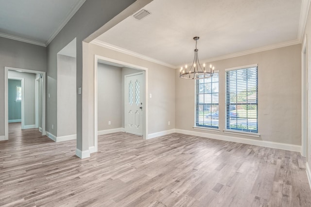 unfurnished dining area with crown molding, a chandelier, and light wood-type flooring