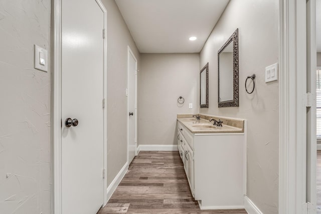 bathroom with vanity and hardwood / wood-style flooring