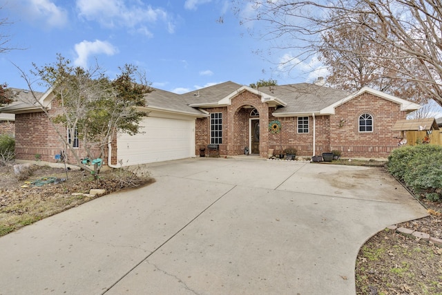 ranch-style house featuring a garage