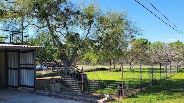 view of gate featuring a lawn