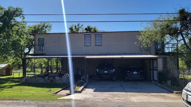 view of front facade with a carport