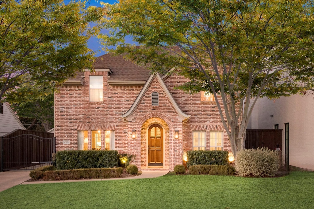 tudor house with a front lawn